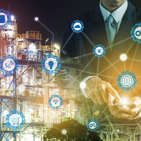 Double exposure of businessman hand hold smartphone working with oil refinery industry plant and industry icons. Factory in the night as communication of energy concept. Smart technology 4.0 and communication.